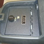 Hidden lockable secure center console vault safe