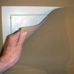 Hidden wall safe behind paintable magnetic cover
