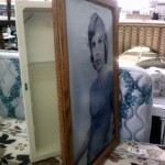 Old Medicine Cabinet Hidden by Picture Frame