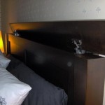 Large secret compartment concealed in top of headboard