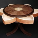 Hidden swing-out compartments in this Lotus Table