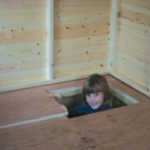Lift up trap door in floor of playhouse