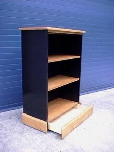 Bookcase with secret drawer compartment in bottom