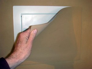 Hidden wall safe behind paintable magnetic cover