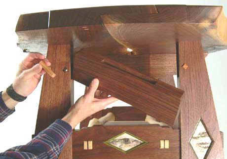 Hidden compartment in wooden table furniture