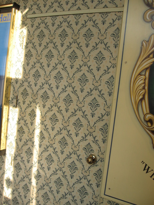 Wall papered door at Stoke Rochford Hall
