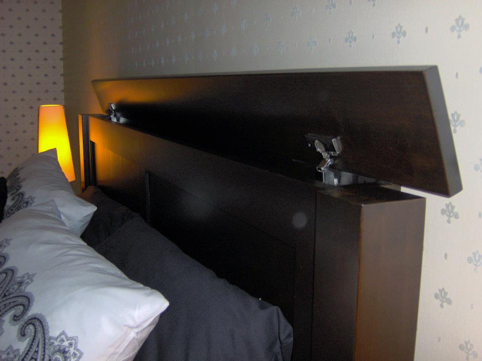 Large secret compartment concealed in top of headboard