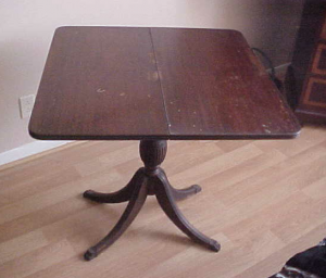 Folding table with secret compartment below