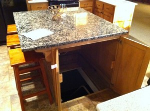 Secret trap door in kitchen island leads to underground shelter