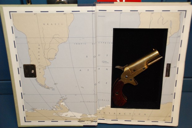 Gun Found in Hollow Book Compartment