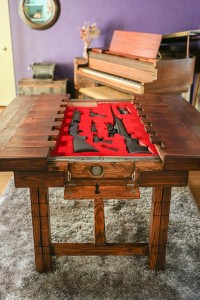 Table Opens to Reveal Firearms Inside