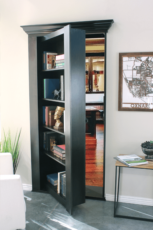 Secret bookcase door with gun room